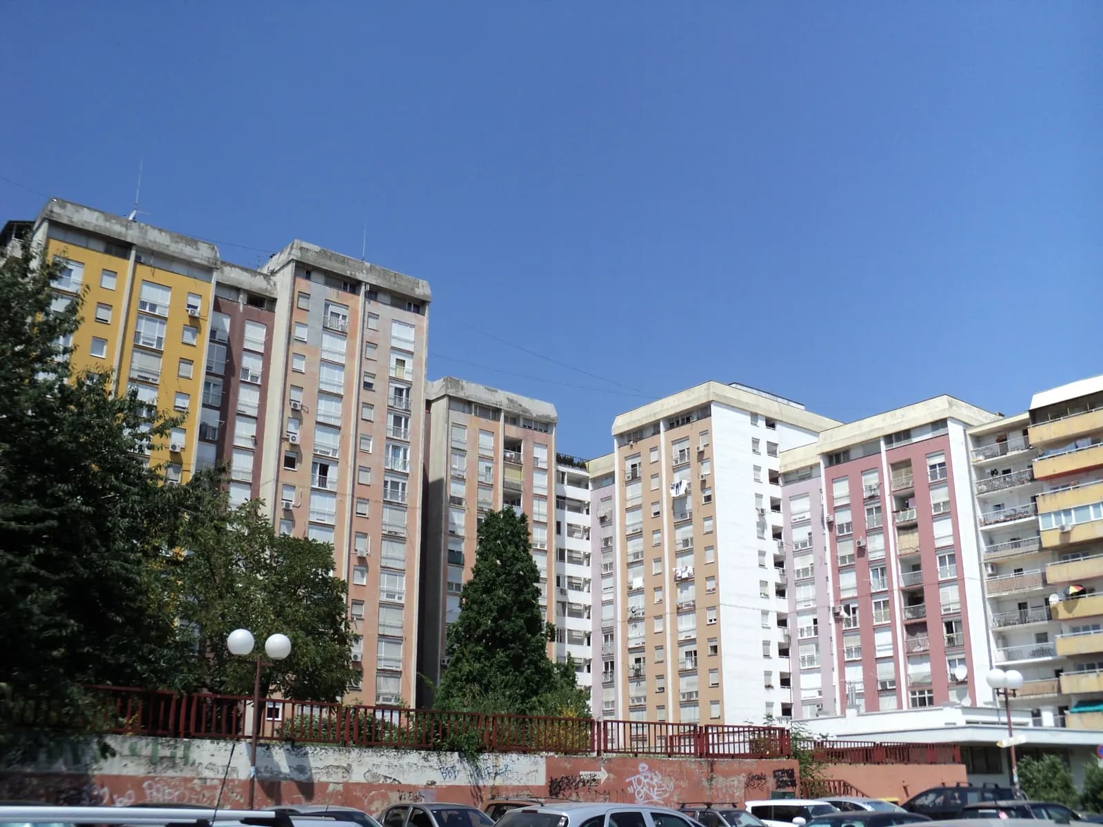 Colourful residential tower blocks known as Papagajke in Trešnjevka, Zagreb, above a car park