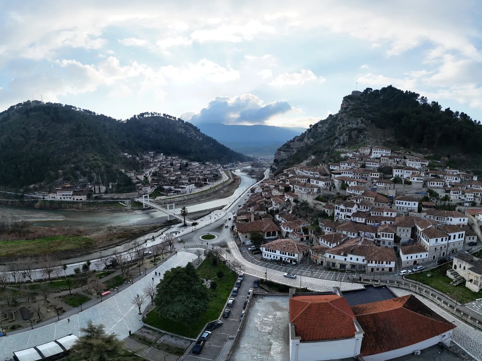 Aerial view of Berat with the white houses of Mangalem and Gorica on the hillsides either side of the Osum river