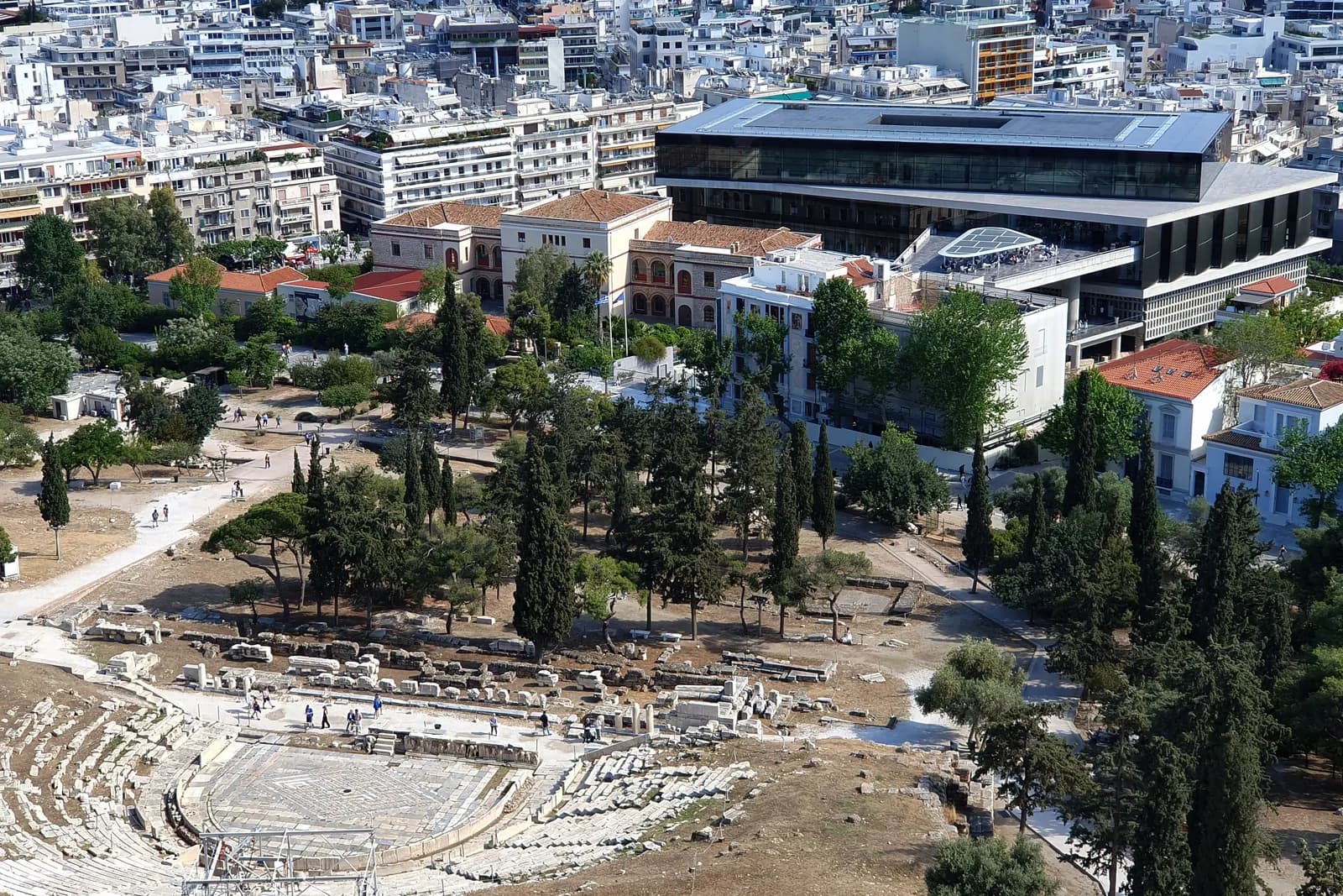 The Theatre of Dionysus on the south slope of the Acropolis, with the Acropolis Museum and the apartment blocks of Makrygianni behind it