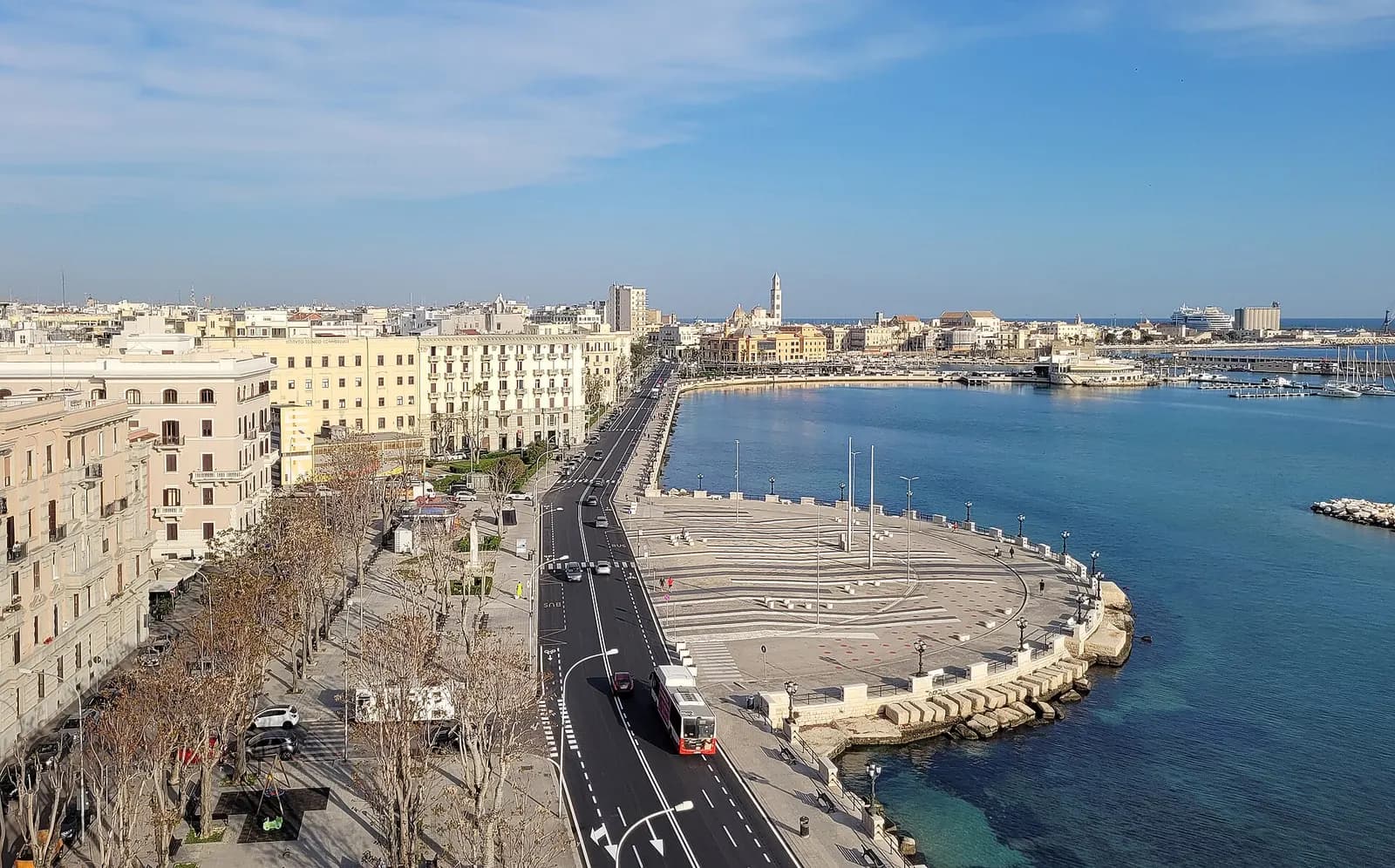 The seafront road of the Lungomare Araldo di Crollalanza seen from above, with the buildings of the Murat quarter on the left and the old town and cathedral tower across the water