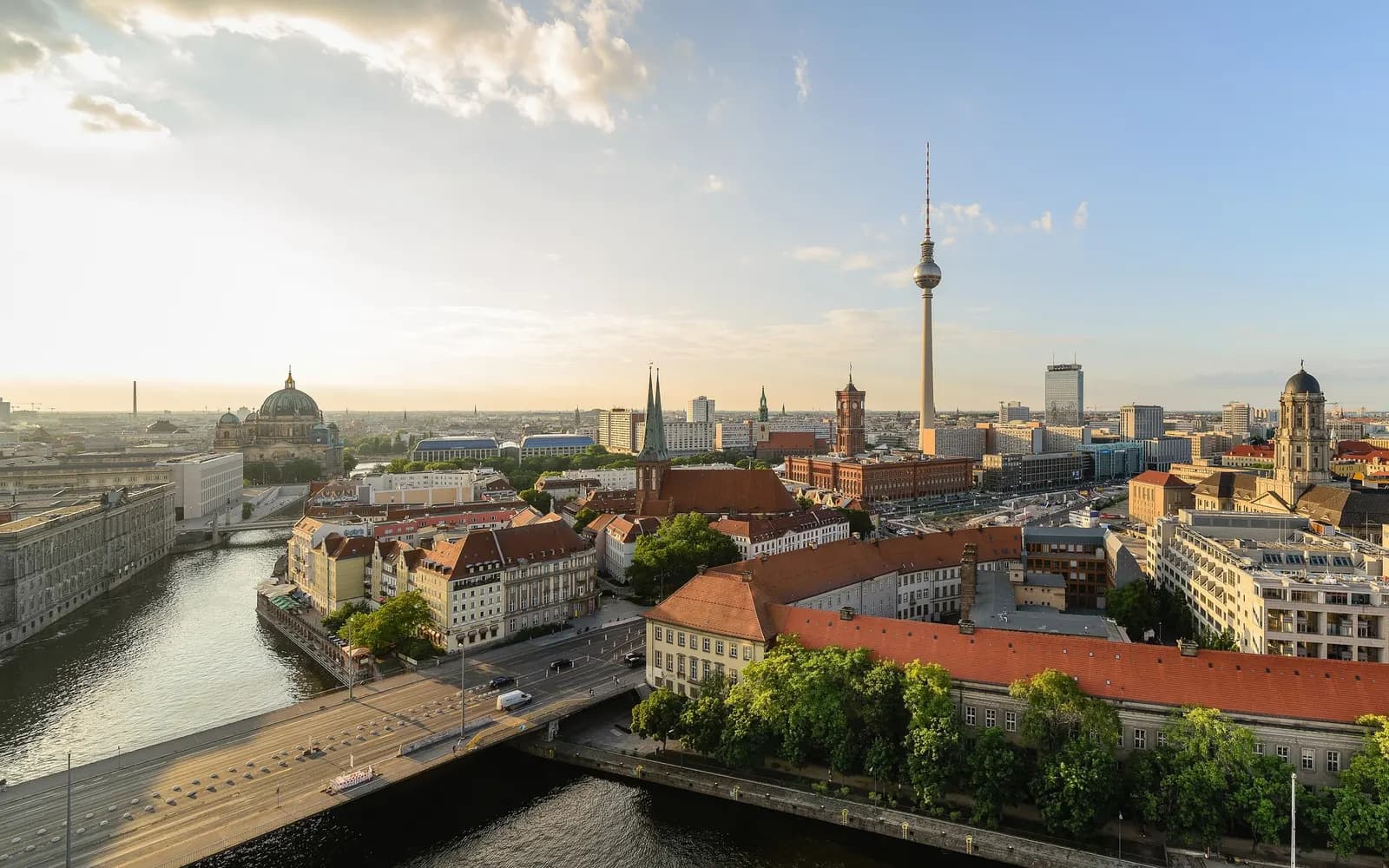 Mitte seen from Fischerinsel: the Spree and Mühlendamm bridge, St. Nicholas Church, the Rotes Rathaus, the Fernsehturm and Berlin Cathedral in evening sun