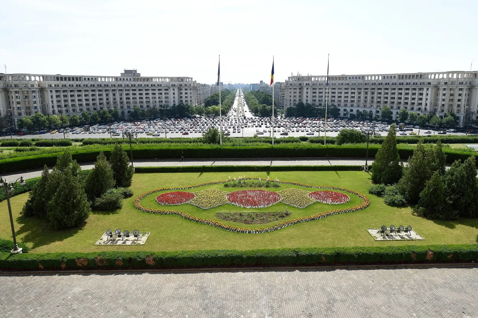 View from the Palace of the Parliament over its flower garden and forecourt towards Bulevardul Unirii, lined with long apartment blocks