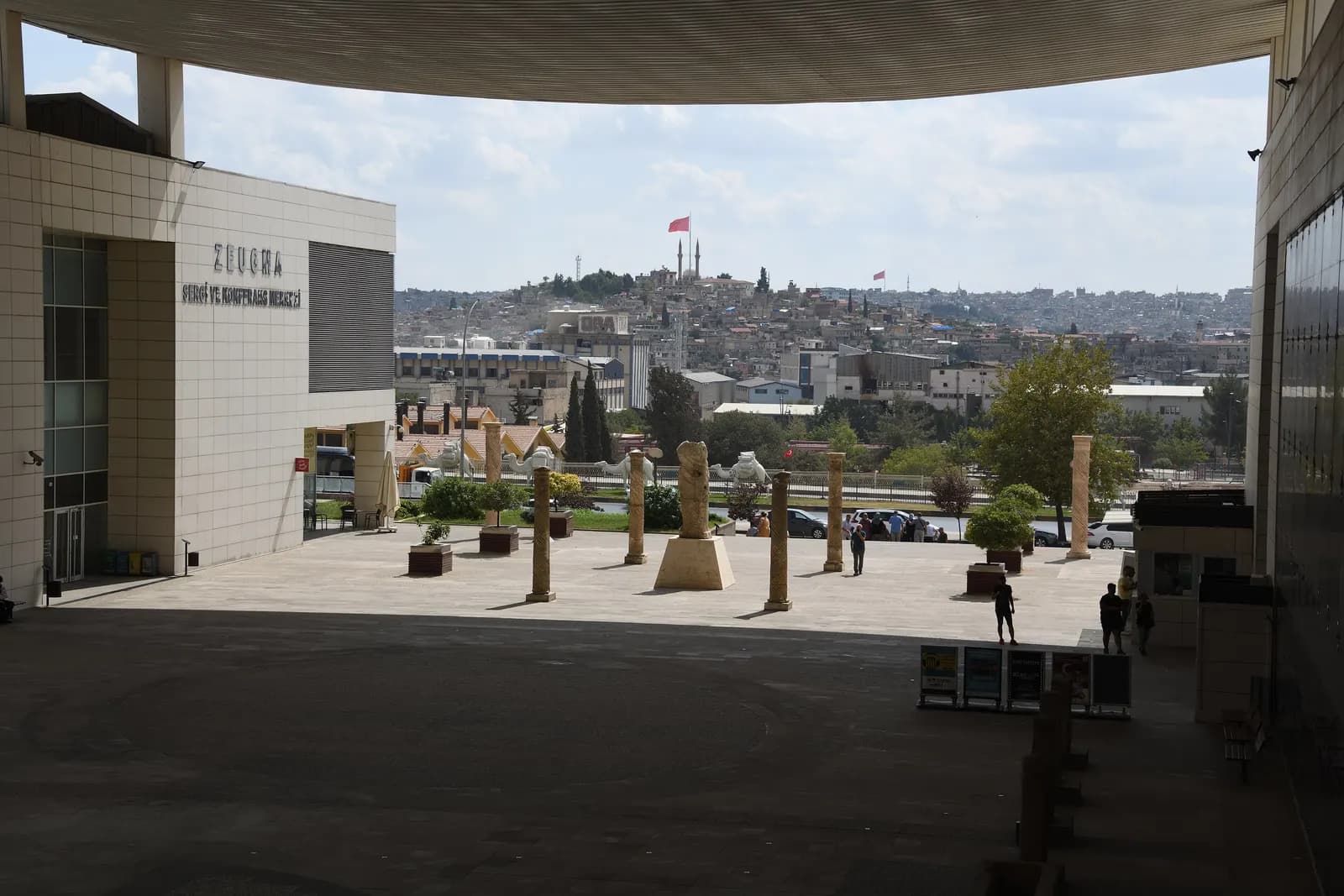 The courtyard of the Zeugma museum complex in Gaziantep, with stone columns and a view over the city
