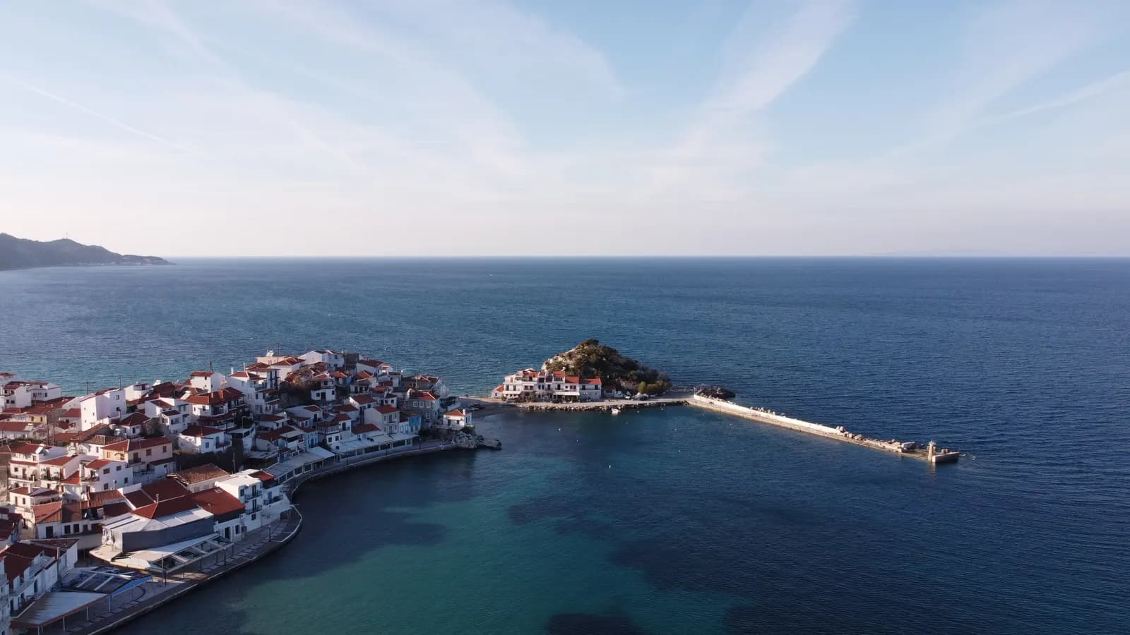 Aerial view of Kokkari on its small peninsula, with the harbour, the breakwater and the open sea
