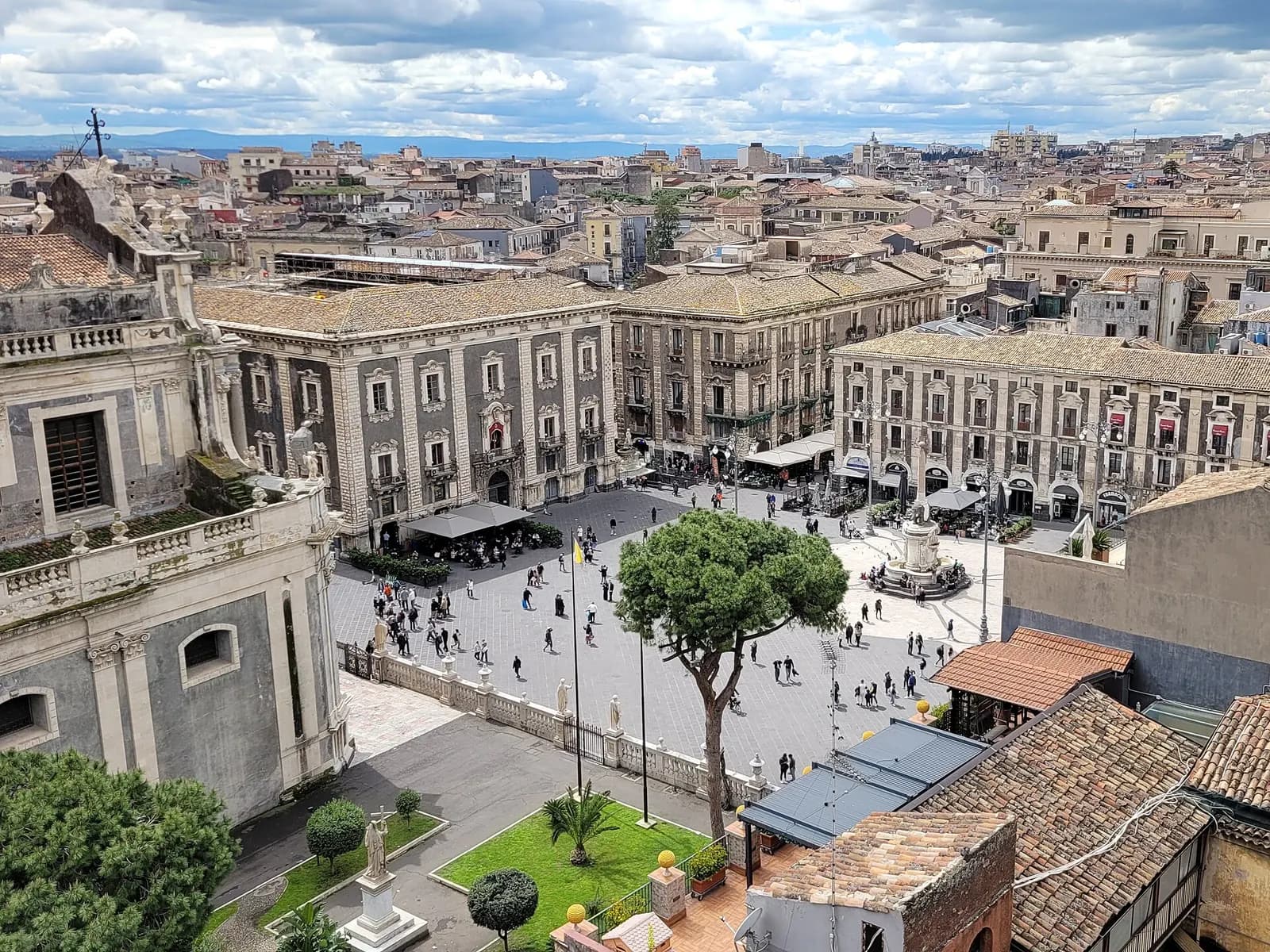 Piazza del Duomo in Catania seen from above, with the elephant fountain, baroque palazzi and the rooftops of the old town beyond