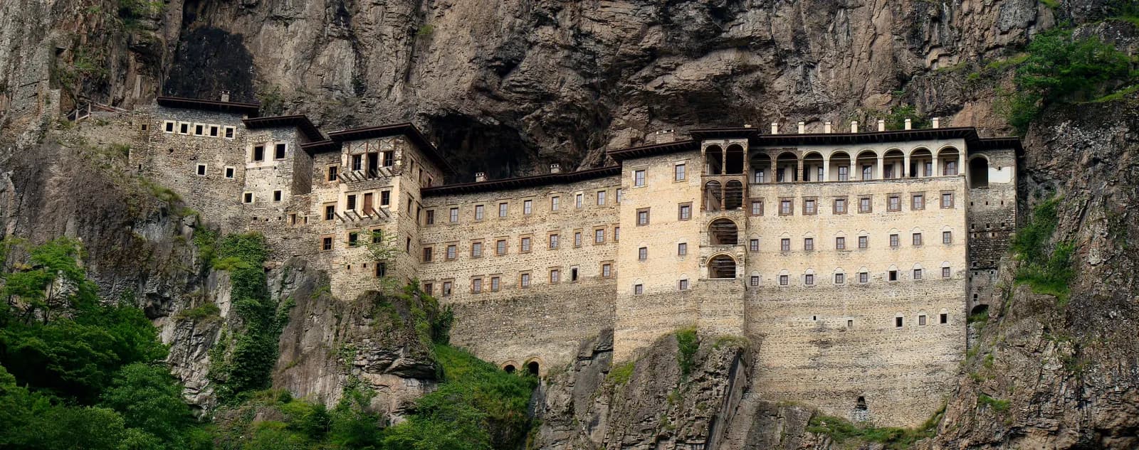 Sumela Monastery built into the cliff face above the Altındere valley, with forest on the rocks below