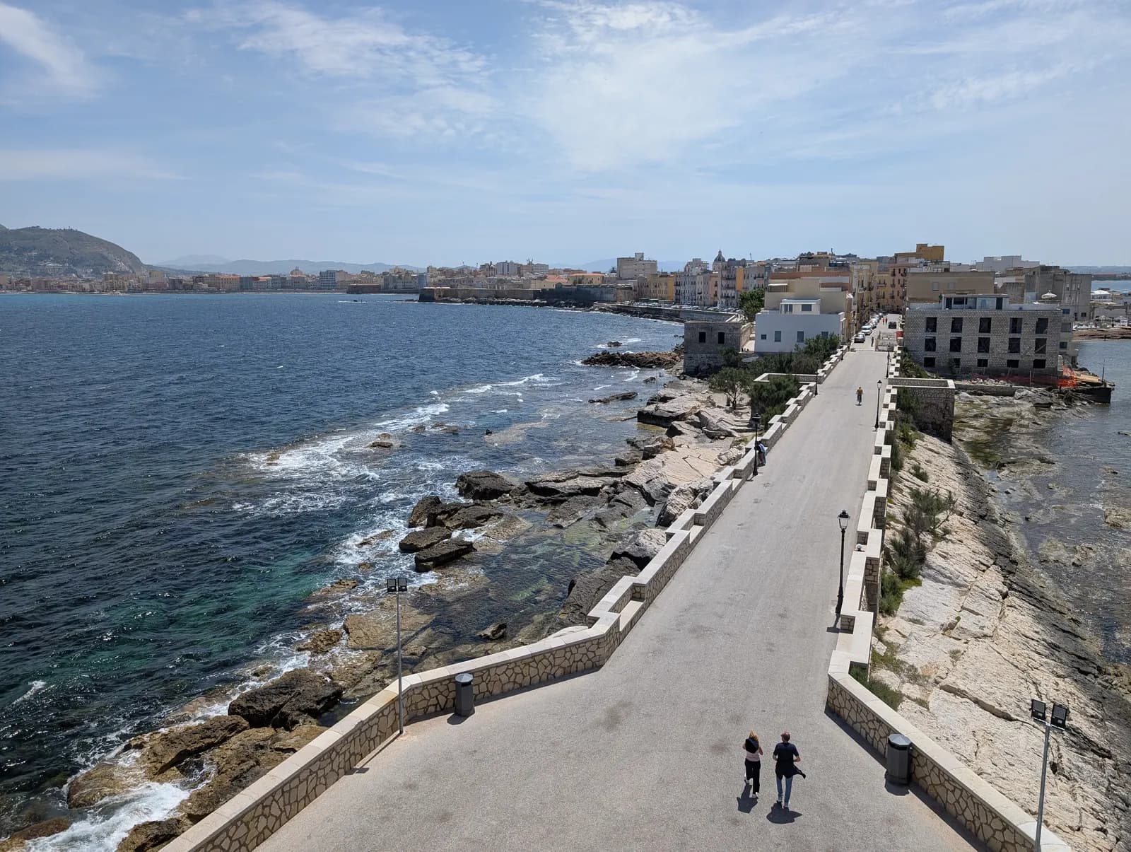 The old town of Trapani seen from Torre di Ligny, with the walkway along the point leading back to the houses and the north gulf on the left