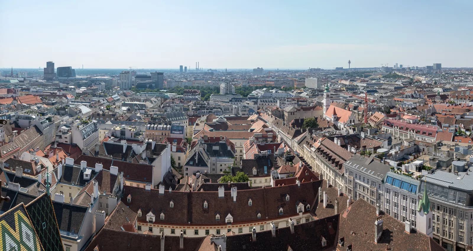 Roofs of the Innere Stadt seen from the south tower of St. Stephen's Cathedral, with the cathedral's patterned tile roof in the lower left corner