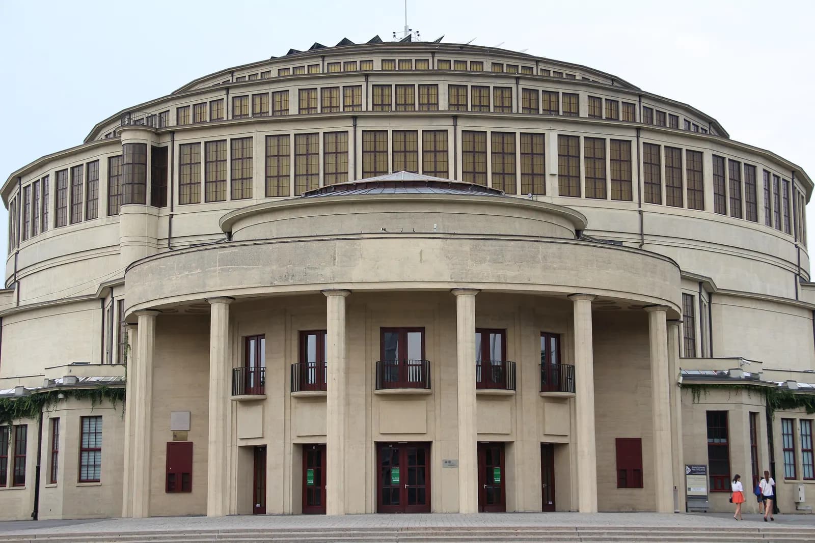 The entrance front of the Centennial Hall in Wrocław: a concrete colonnade under the stepped rings of the dome